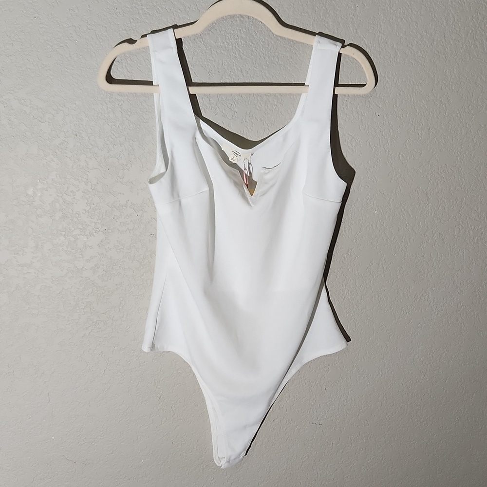 Entro bodysuit size L white has pencil mark see pics new